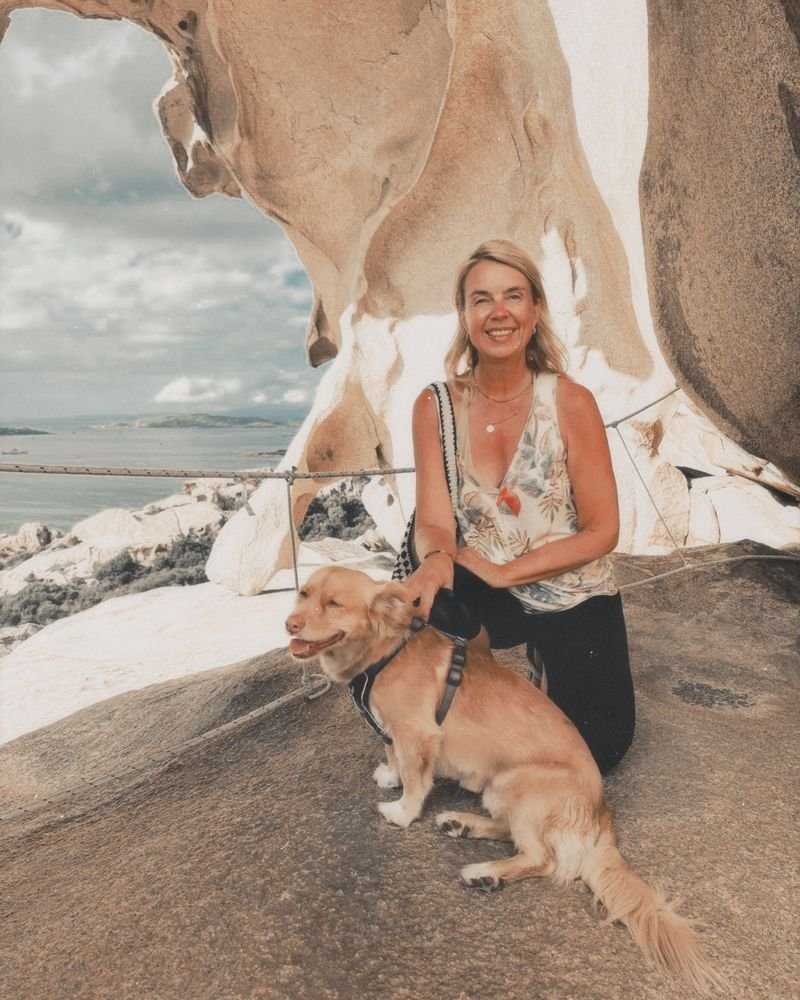 Elke Bayer with her dog at Capo d'Orso